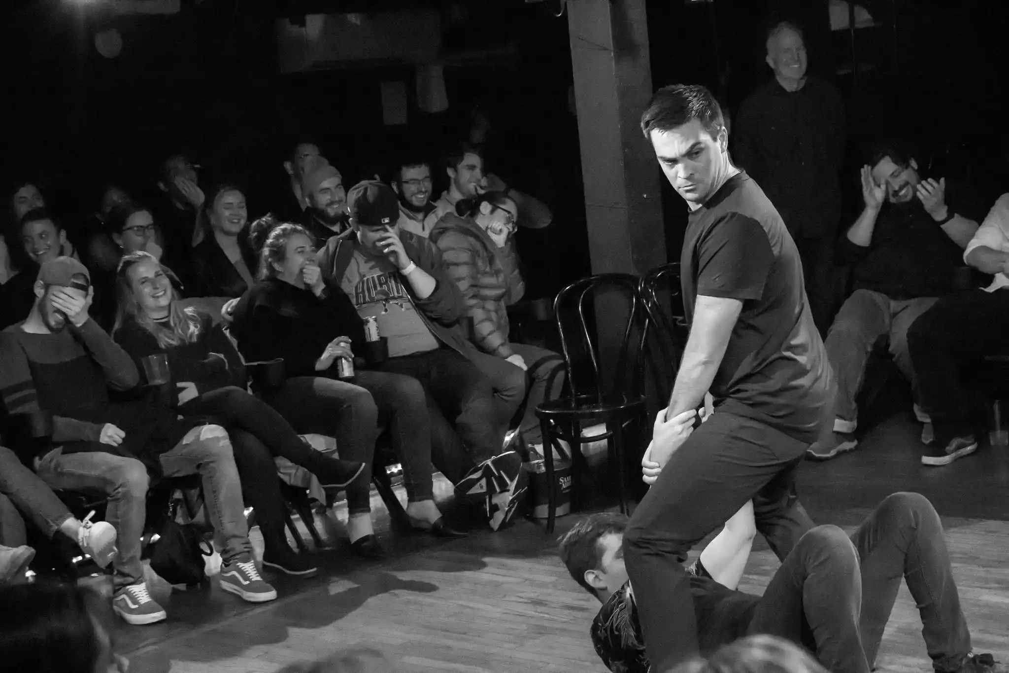 Laughing audience during Psyched Out Comedy's improv psychic performance